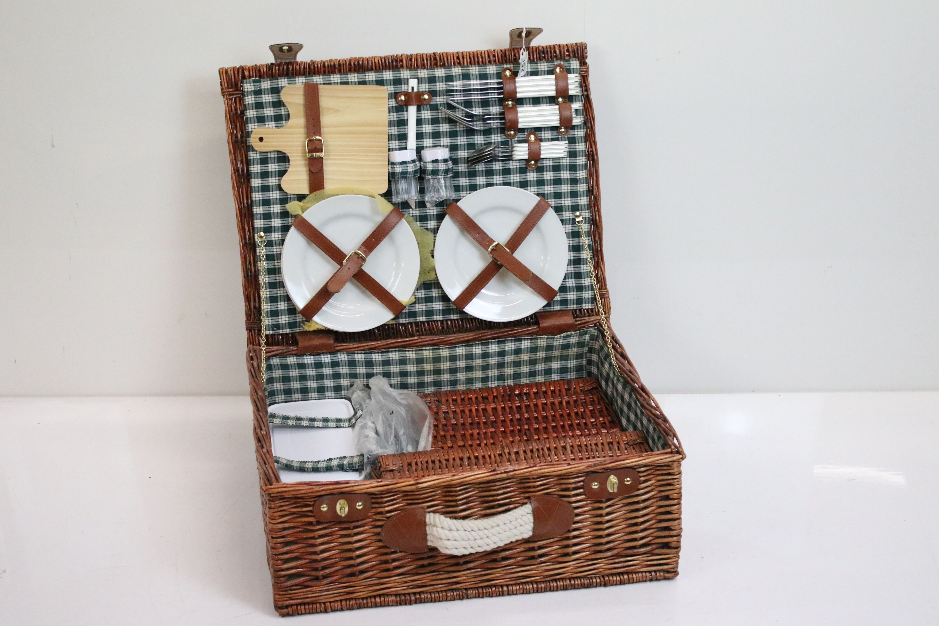 Four person picnic set in three wicker baskets, comprising cutlery, mugs, champagne glasses,