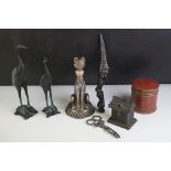 A box of mixed collectables to include a cast iron devil winged dagger, a pair of oriental storks,