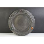 A decorative pewter plate in the Art Nouveau style set with three coloured stones.