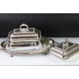 A silver plated tray together with three silver plated serving dishes and a selection of napkin