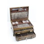 A wooden two drawer canteen of silver plated cutlery by Mappin & Webb
