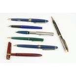A small collection of vintage pens to include a Parker example with 14k gold nib.