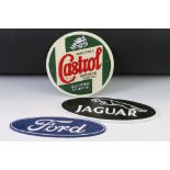 A group of three cast iron painted signs to include Ford, Jaguar and Castrol examples.