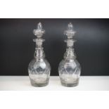 Pair of Georgian Cut Glass Decanters with star cut bases and Heavy Stoppers, 32cm high