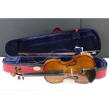 A Stentor Student II violin with box and bag.