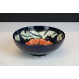 Moorcroft ' Poppy ' pattern small blue ground bowl / trinket dish, dated '96, 11.5cm diameter