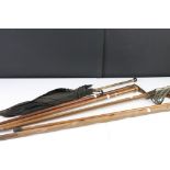 A collection of walking sticks to include silver mounted examples together with an antique sword.