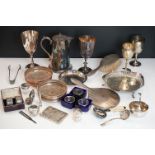 A collection of silver plated items to include bottle coasters, goblets, coffee pot...etc.