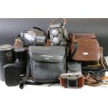 A collection of mixed photographic equipment to include a Rolleiflex twin lens reflex camera, a