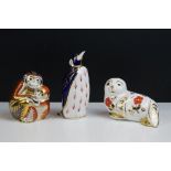 Three Royal Crown Derby paperweights, comprising: a penguin with gold stopper, 14cm high, a seal