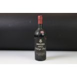 A sealed bottle of Martinez 1967 Vintage Port.