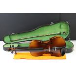 A vintage violin with inner label marked Antonius Stradivarius Cremonensis, complete with bow and