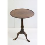 George III mahogany tripod table, one pad foot chewed, approx. 56cm diameter