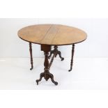 Victorian Burr Walnut and Walnut Oval Sutherland Table raised on reeded bulbous supports and