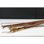 Collection of hiking and walking sticks & an Edwardian hazel bow extension