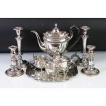 A collection of mixed silver plate to include a tea set, tray, water jug and two pairs of