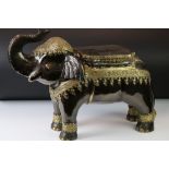 Patinated spelter elephant seat / stool with applied brass decoration in the Indian style, 41cm H