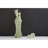 An oriental carved jade figure in traditional dress together with a carved horse.