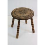 Late 19th / Early 20th century Elm Stool with carved top and four bobbin legs, 34cm diameter x