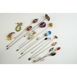 A collection of antique Victorian and Edwardian hat pins to include glass topped examples plus two