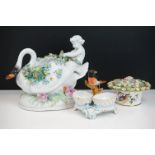 Group of three 19th Century porcelain pieces, comprising: a putti riding a flower encrusted swan,