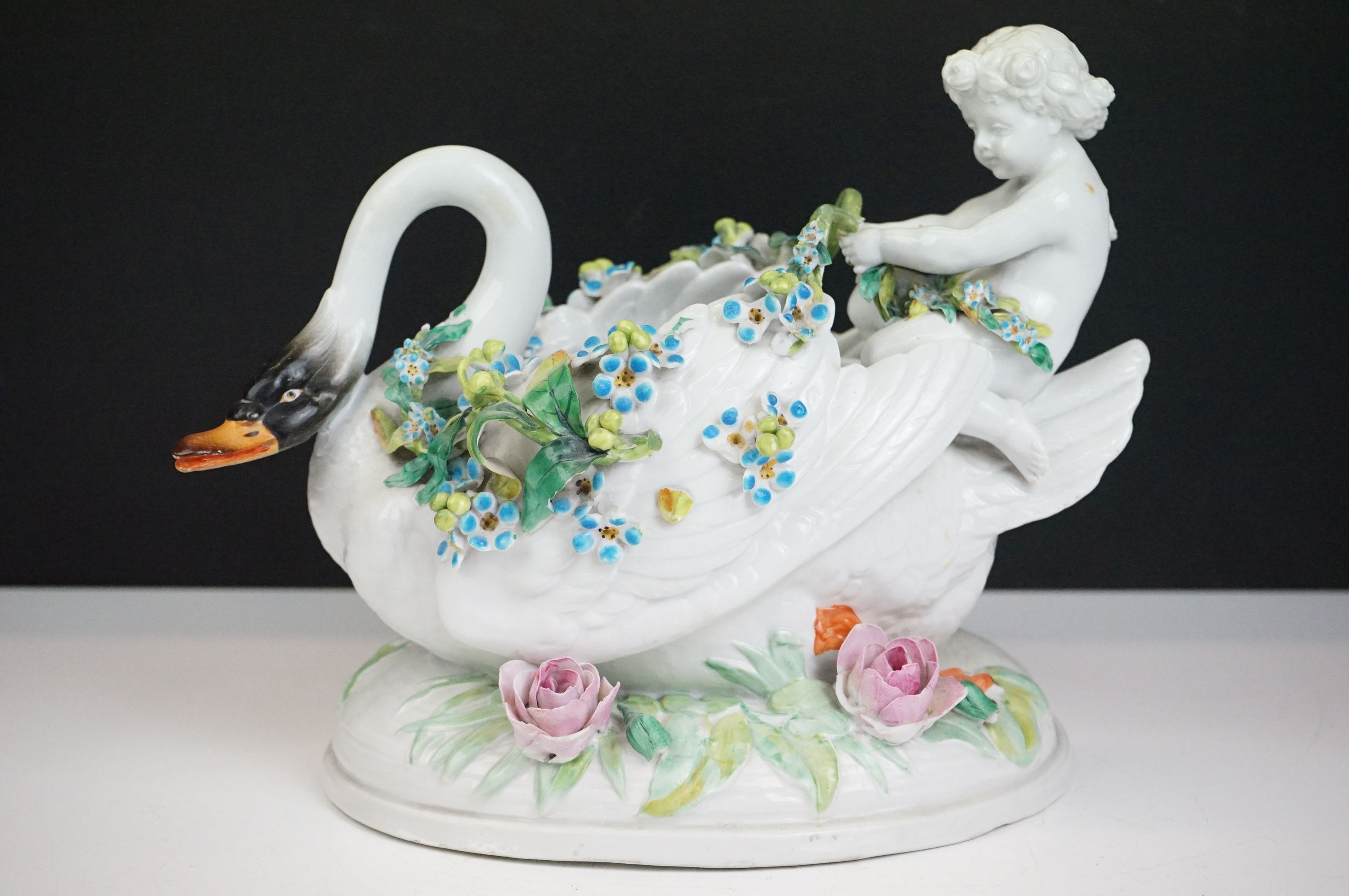 Group of three 19th Century porcelain pieces, comprising: a putti riding a flower encrusted swan, - Image 13 of 19