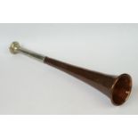 An antique copper hunting horn with nickel mouth piece, maker marked for Ball Beavan & Co of London.