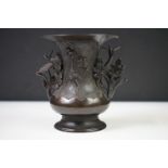 Chinese bronze Gu-shaped beaker vase, with applied figural decoration on a textured ground, twin