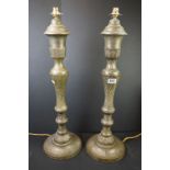 A pair of Middle Eastern brass table lamps together with a pair of back shades, lamp bases measure