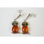 Pair of silver and amber owl shaped drop earrings