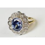 Silver dress ring set with CZs and large faux tanzanite central stone