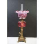 19th Century French oil lamp by Gaudard, with streaked cranberry glass shade, cranberry glass