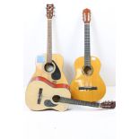 A collection of three six string acoustic guitars to include a Yamaha example.