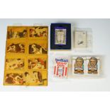 A group of collectable playing cards to include erotic Japanese and Kennedy examples.