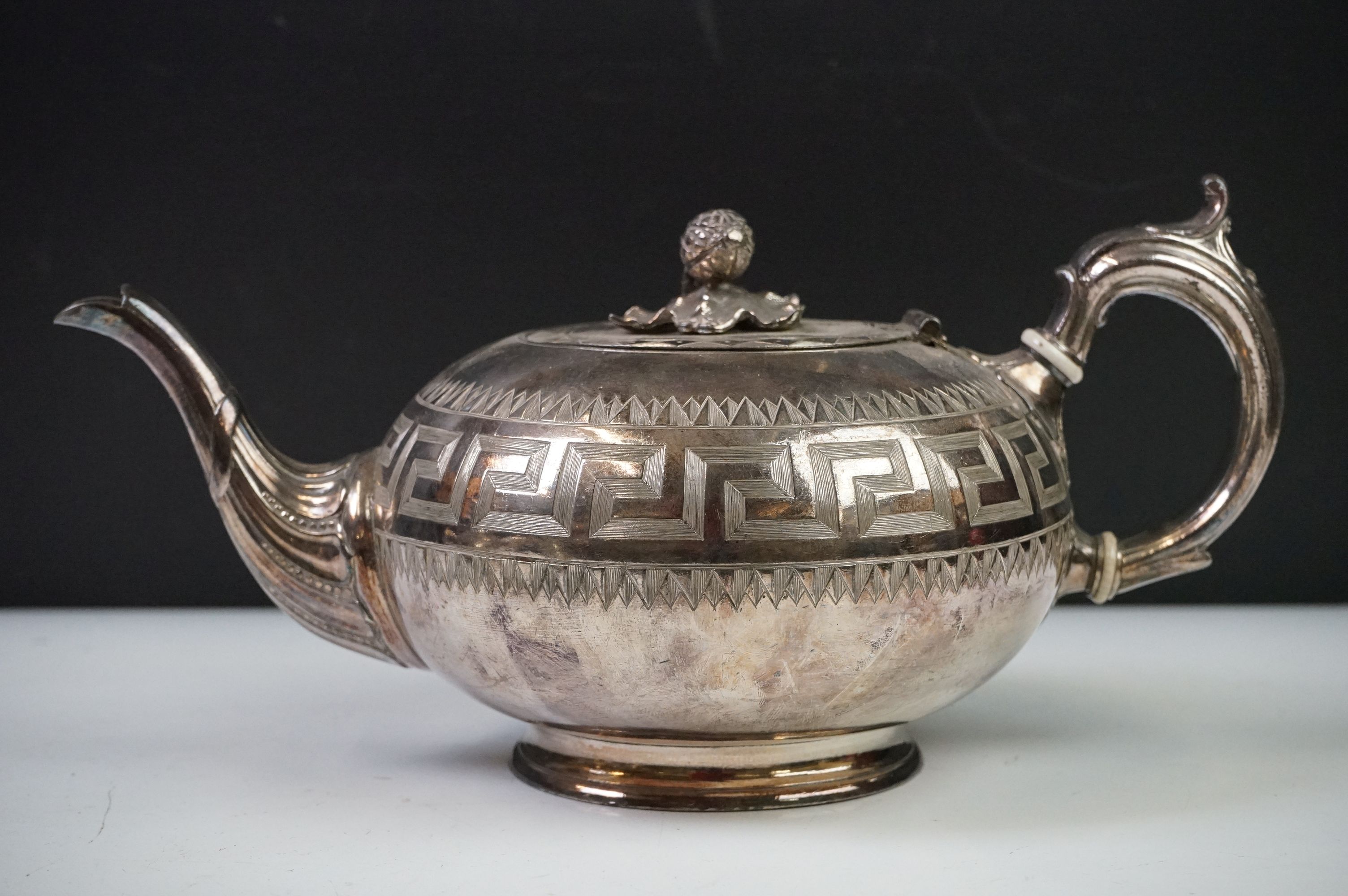 An antique silver plated tea set to include teapot, cream jug, sugar bowl and water jug decorated - Image 16 of 22