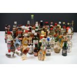 A large collection of miniature bottled spirits to include Whisky, Brandy, Gin...etc.