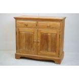 Ercol Light Elm Dresser Base with two drawers over two cupboard doors, 92cm long x 45.5cm deep x