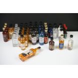 A collection of miniature bottled spirits to include West Cork Whiskey, Sixty Six Rum, J.J.