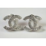 Pair of silver & CZ designer style stud earrings