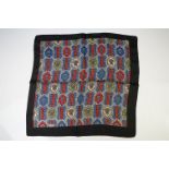 Liberty of London Silk Scarf decorated with a pattern within a black border, 43cm x 43cm