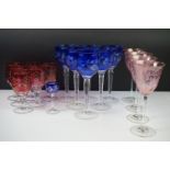 20th Century glassware - A set of six cobalt blue cased wine glasses with cut tree branch decoration