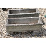 Pair of reconstituted stone rectangular planters on stands, 65cm long x 30cm high