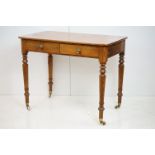 19th century Pine Side Table with two drawers, raised on turned legs with castors, 91cm long x