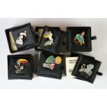 A collection of six limited edition Guinness advertising badges within original display cases with