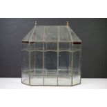 Leaded glass terrarium of octagonal form, featuring four small red glass panels. Measures approx