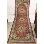 Red Ground Silk Mix Rug decorated with three central medallions within a white ground border, 95cm x