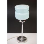 Art Deco chrome table lamp with pale blue glass shade, raised on an octagonal base. Measures
