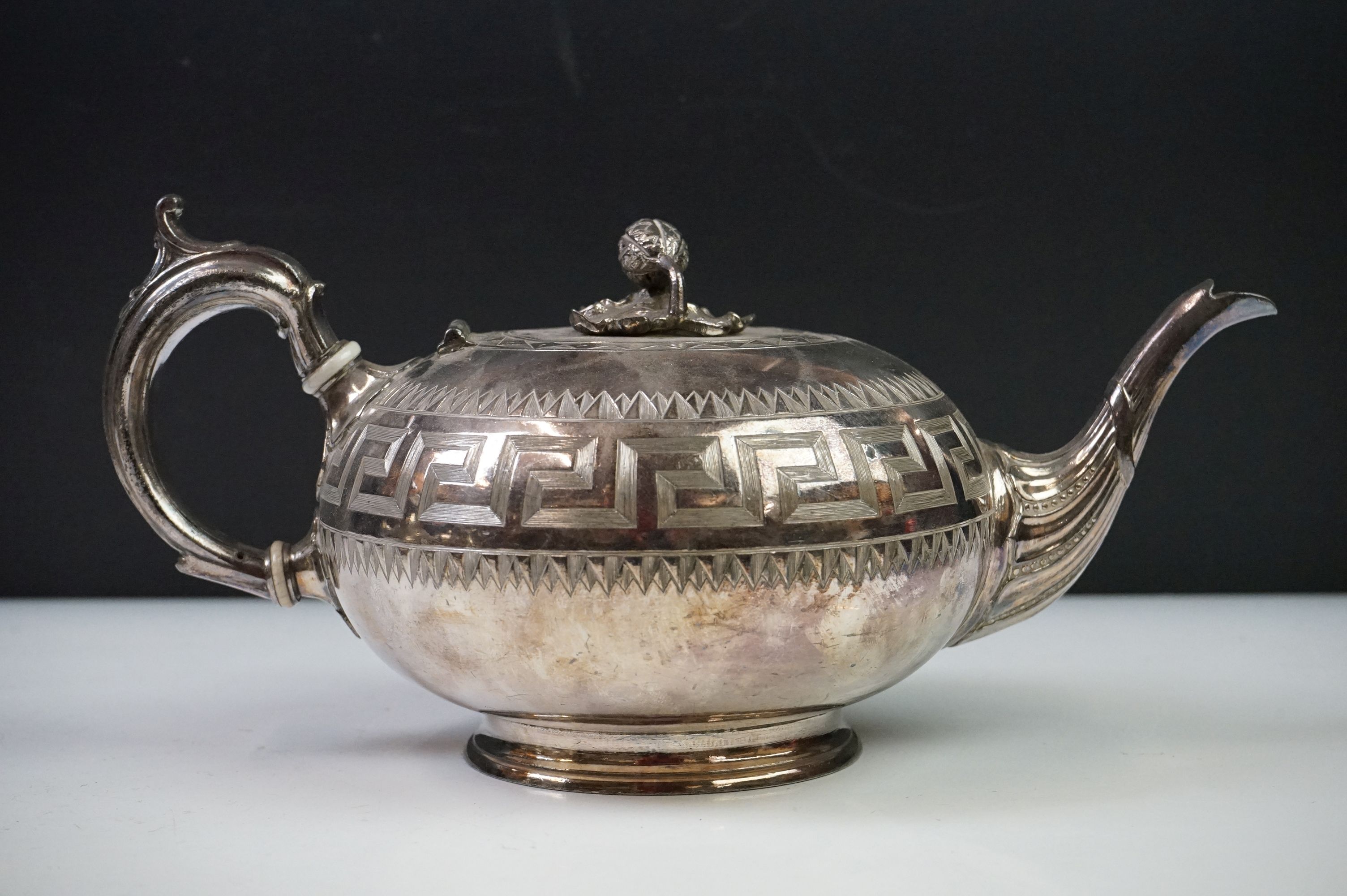 An antique silver plated tea set to include teapot, cream jug, sugar bowl and water jug decorated - Image 18 of 22