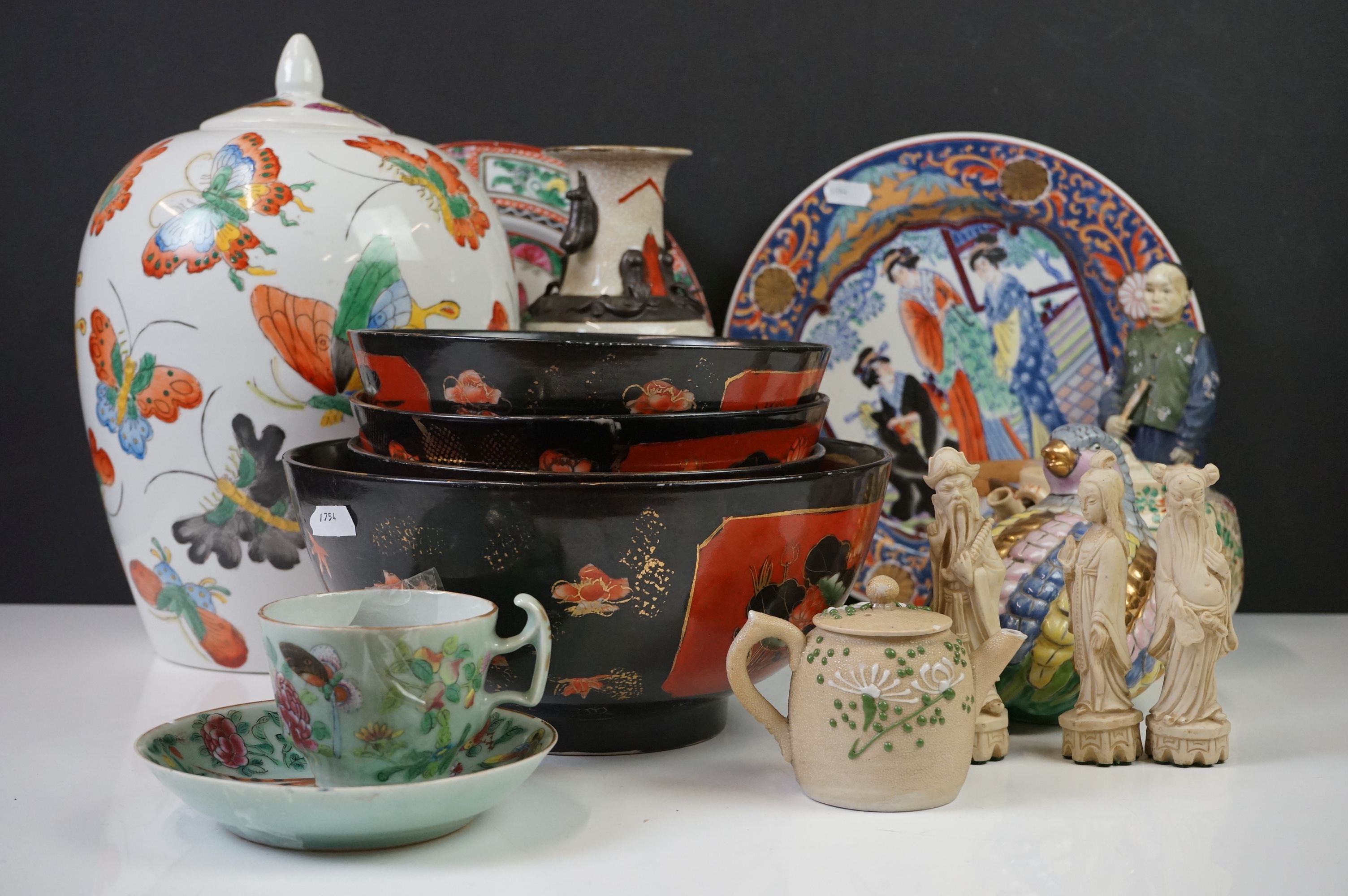 Collection of Oriental ceramics & figures to include a Famille Rose teacup & saucer on celadon style