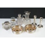 A group of fully hallmarked sterling silver to include candlesticks, silver topped jug, silver